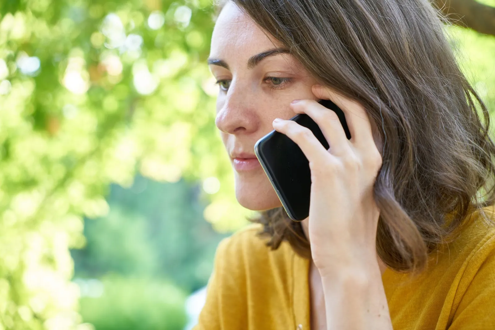 A business owner taking a call outdoors